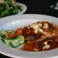 Salmon Alla Calabrese · Sundried cranberries, tomato and herbed white wine sauce.