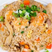 Combo Japanese Fried Rice · Fried white rice with chicken, shrimp, and beef, soy sauce, eggs, onion, carrots and green o...