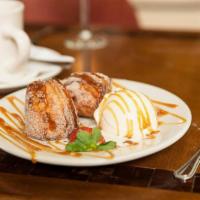 Rabanada · A warm cinnamon pastry with a creamy center served with vanilla ice cream laced with caramel...