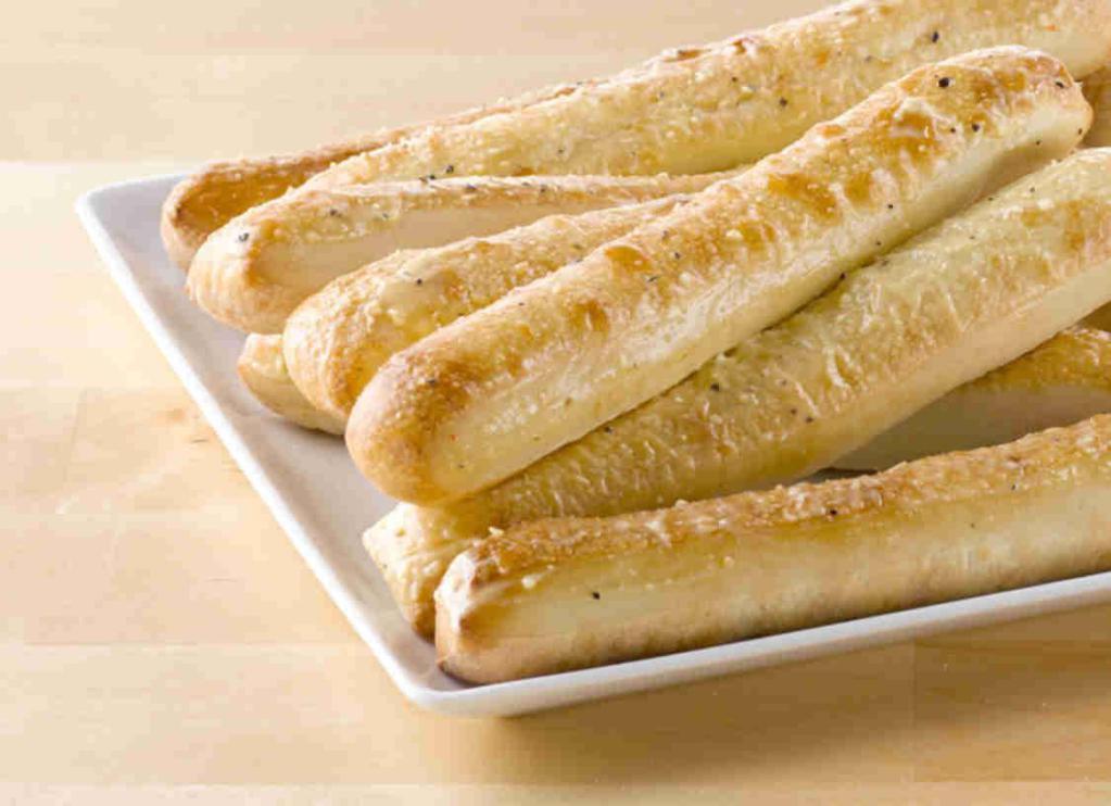 Garlic Parmesan Breadsticks · Fresh-baked and brushed with garlic sauce and seasonings.