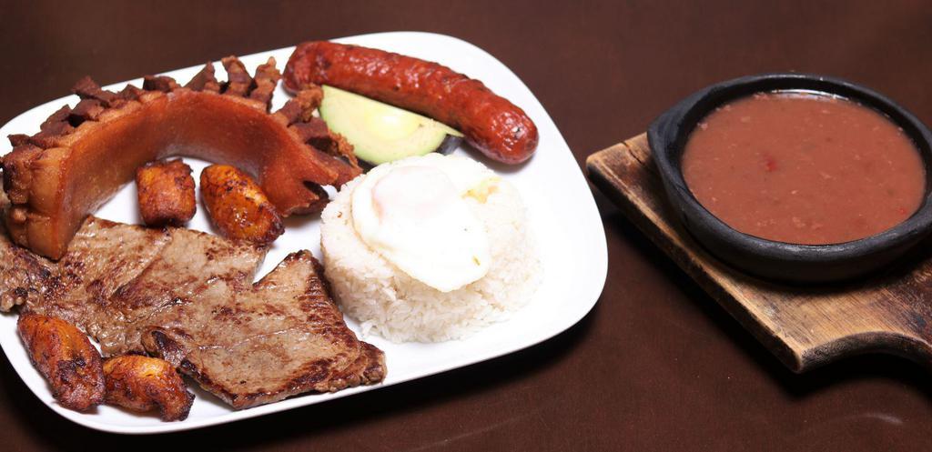 Mini Typical Colombian Dish Plate · Rice and beans, grilled steak, pork loin, fried egg, corn cake and sweet plantains.