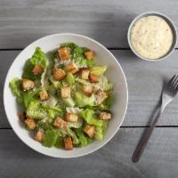 Caesar Salad · Romaine lettuce, tomatoes, croutons, and shaved parmesan cheese with Caesar dressing.