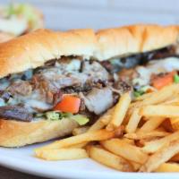 All American Cheese Steak · Thinly sliced ribeye steak with sauteed onions, mushrooms, and melted provolone cheese. Serv...