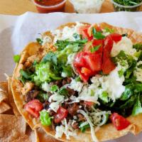 Fiesta Tostada Combo · A crispy flour tortilla bowl filled with choice of chicken or beef, lettuce, tomatoes, green...