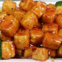 General Tso Tofu · Served with broccoli. Hot and spicy.