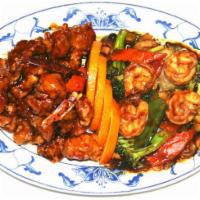 7. Dragon and Phoenix · Jumbo shrimp with mixed vegetable on one side and general tso's chicken on the other side. S...