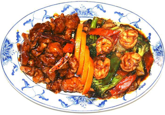 7. Dragon and Phoenix · Jumbo shrimp with mixed vegetable on one side and general tso's chicken on the other side. Served with white rice. Spicy.