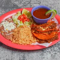 Red Tacos/ Tacos Rojos · Three lamb red tacos with onions, cilantro, and cheese accompanied with lamb soup. tres taco...
