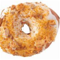 ButterFinger · Ring donut with white icing and Butterfinger crumbs. 