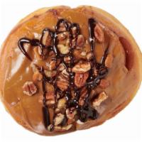 Poor Man's Pecan Pie · Maple icing, pecan pieces and chocolate drizzle; all on a jumbo roll!