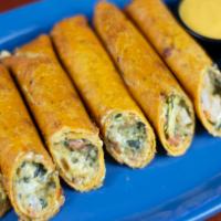 Fatz Cajun Firecracker Stix · Fatz's most famous appetizer is back! Crispy tomato basil wraps filled with creamy spinach a...