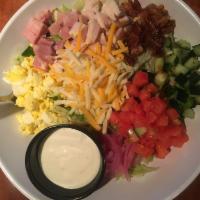 Chopped Southern Chef Salad · Oven-roasted turkey, ham, and bacon on mixed greens with Monterey Jack and cheddar cheeses, ...