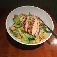Grilled Chicken Caesar Salad · Grilled chicken on fresh romaine, tossed in a creamy Caesar dressing with Parmesan cheese an...