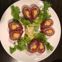 S. Sweet Heart Roll · Spicy tuna, crispy tempura crunch and avocado wrapped with slices of fresh tuna.