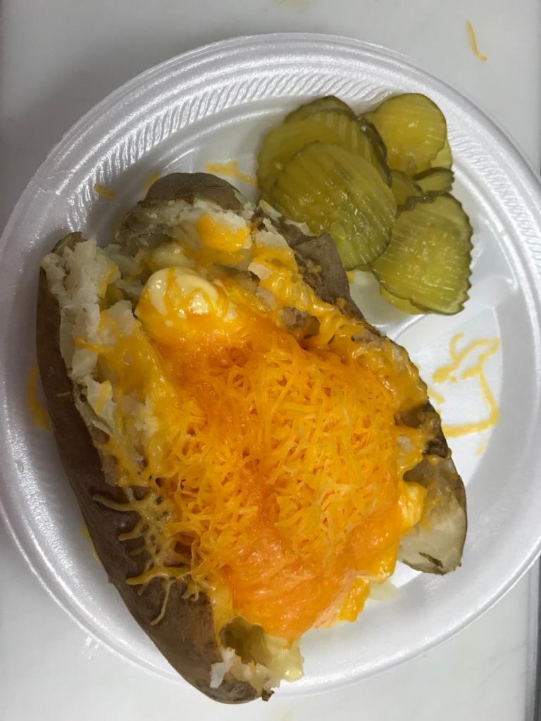 #1. Cheese Spud · Served with margarine & heaped with cheddar cheese.
