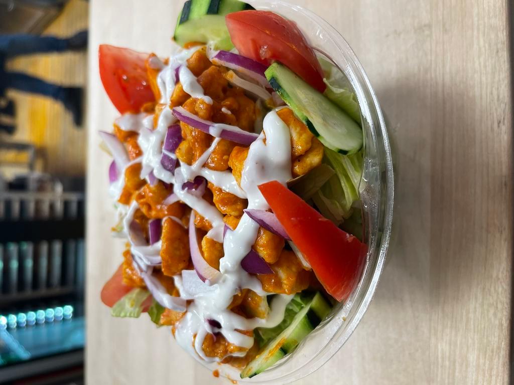 Buffalo Chicken Salad · Romain lettuce, red onions, tomatoes, Buffalo chicken, mozzarella, crumbled bacon and blue cheese dressing.