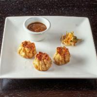 Shrimp Dumplings · Scallion, bamboo shoots, carrot & garlic.  Steamed or fried.