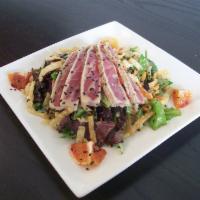 Seared Ahi Tuna Salad · Served over mixed greens with carrot, jicama, orange, honey almonds & crispy wonton strips. ...