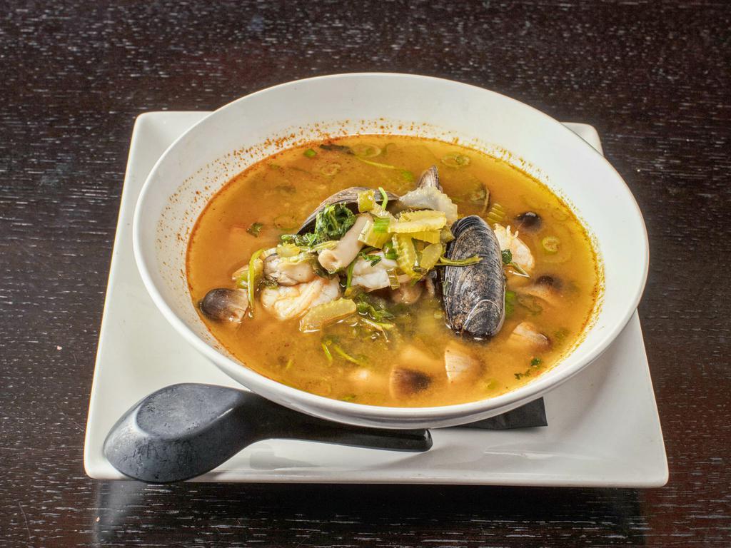 Seafood Tom Yum Soup · shrimp, white fish, mussels, tomato, and mushroom in spicy citrus broth. 