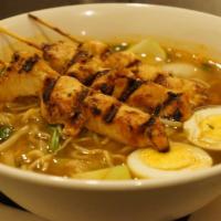 Ramen Bowl · Grilled chicken with red curry broth, baby bok choy, onion and soft boiled egg. 