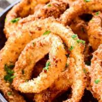 Onion Rings · Crunchy, battered, and fried onion rings.