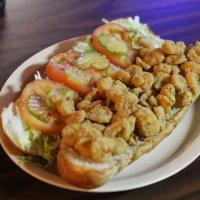 Shrimp Po-Boy · Dressed with mayo, lettuce, tomatoes and pickles served on French bread.