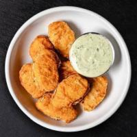 Plant-Based Chicken Nuggets · Plant-based chicken nuggets served with your choice of sauce.