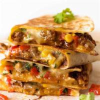 Quesadilla San Miguel-Double · Hand made grilled flour tortilla filled with melted asadero cheese, sirloin steak, toasted b...