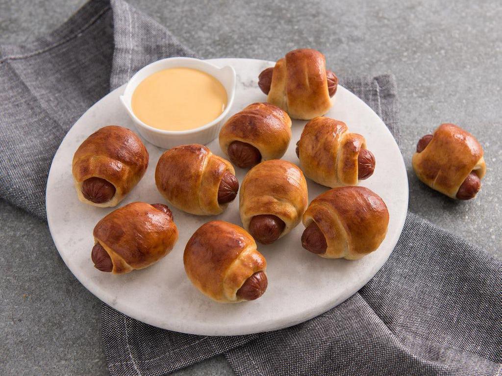 Mini Pretzel Dogs · Bundled up one at a time and baked fresh every time. Mini Pretzel Dogs made with Nathan’s Famous® hot dogs pack a bite.