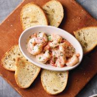Shrimp Scampi · Garlic, white wine, and our lemon butter sauce served with baked bread.