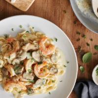 Fettuccine Weesie · Fettuccine Alfredo with sautéed shrimp, scallions, basil, garlic and mushrooms in our white ...