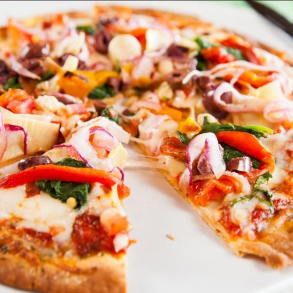 Veggie Pizza · (321 cal, 14 gm fat, 56 gm carbs, 17 gm protein) Red sauce, tomato, spinach, red onion, artichokes, mixed bell peppers, Kalamata olives, and daiya vegan cheese or mozzarella cheese.