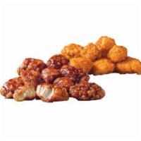 Sauced Jumbo Popcorn Chicken® · 100% all-white meat chicken with a traditional crispy coating tossed in sauce.
