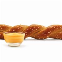 Soft Pretzel Twist · A soft pretzel twisted into a tasty treat and served with Signature Cheese Sauce!