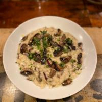 WILD MUSHROOM RISOTTO    · Wild Mushroom Risotto, topped with Truffle Oil