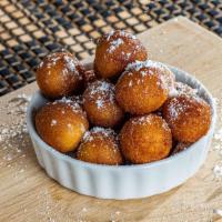 9 Fried Donut Holes · Fried donut holes, hand tossed in cinnamon sugar.
