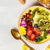 Tropical Acai Bowl · Fresh acai prepared with pineapple, raspberries, banana, and granola.