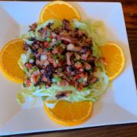 Octopus salad/Ensalada de Pulpo  · Octopus, lettuce, Tomatoes, onions, peppers & cilantro in lime juice