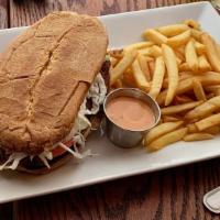 Chimi · Homemade patty on the grill with onions, cabbage and house  sauce with choice of beef or chi...