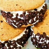 Slutty Brownie Cookie · Two cookies sandwiched between a brownie, filled with buttercream and rolled in chocolate ch...