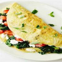The Mediterranean Omelette · Tomatoes, spinach and Choice of cheese.