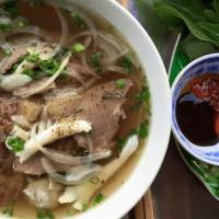 P1. Special Pho ·  Pho dac biet. Noodle soup with round eye steak, well done brisket, well done flank.