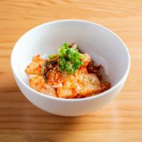 Kimchi · Fermented napa cabbage with sesame seeds and scallions.
