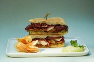 Pulpo Sandwich · Grilled octopus, spanish chorizo, patatas, onions  & herbs aioli 