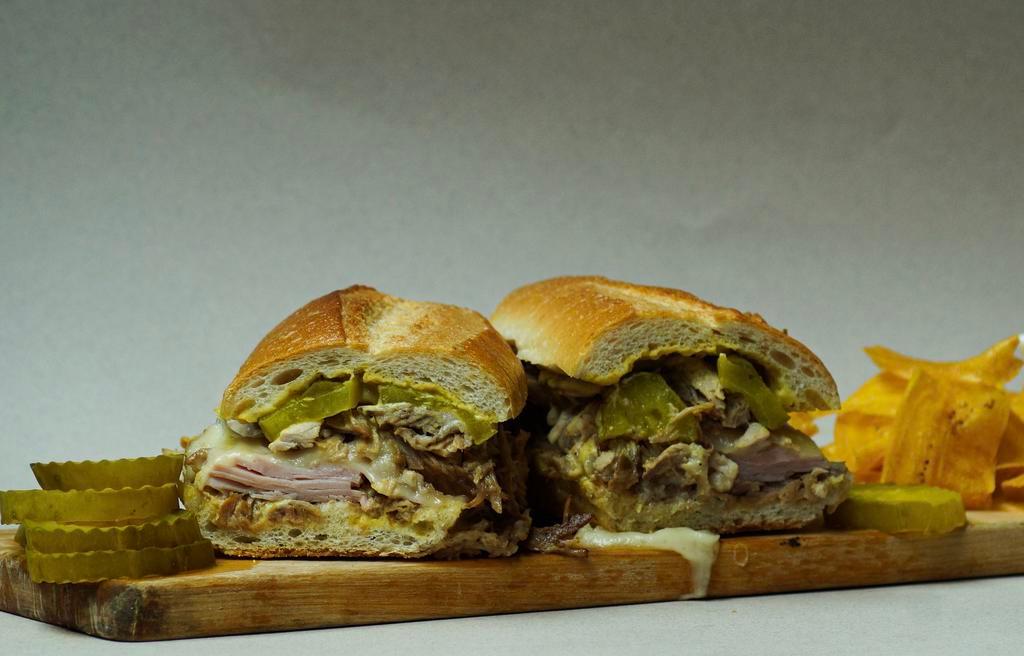 Cubano · Suckling pig, ham, swiss cheese, pickles, mustard aioli 