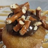 Chocolate Salted Caramel Donut · Chocolate base. Served with crushed pretzel and salted caramel.
