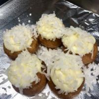 Coconut Cake  · Vanilla cream paired with coconut flakes. 