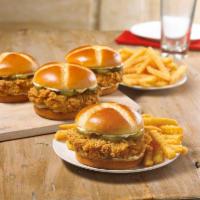Chicken Sandwich Feeds 4 · We crafted a sandwich using our legendary hand-battered chicken filet placed between a honey...