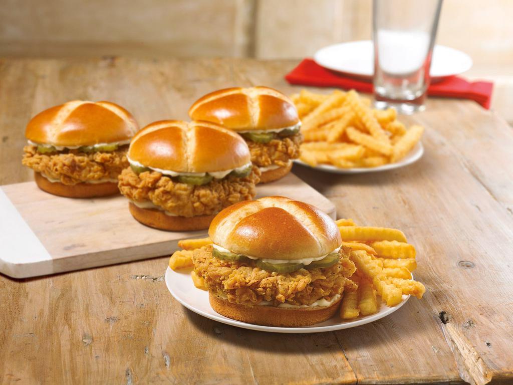 Chicken Sandwich Feeds 4 · We crafted a sandwich using our legendary hand-battered chicken filet placed between a honey-butter brushed and toasted brioche bun. Enjoy this down home flavor with a group with four sandwiches, two large sides, and four frosted honey-butter biscuits.