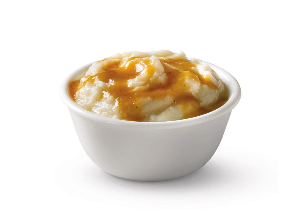 Mashed Potatoes · Before you even get to the potatoes, let's talk about silky, savory, rich gravy. OK, now that we've done that, imagine it poured over a generous portion of smooth, whipped, delicious mashed potatoes.